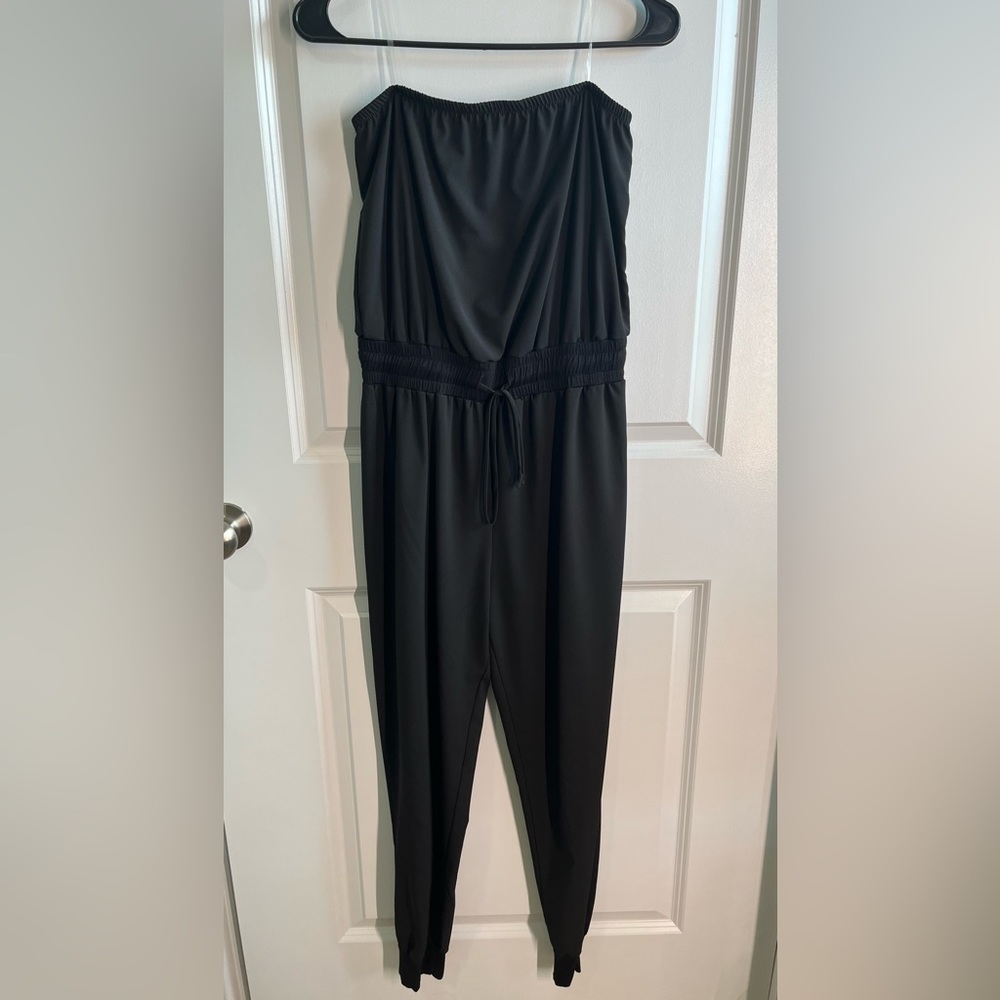 Black strapless jumpsuit size small. Draw string waist and fitted ankle cuffs.